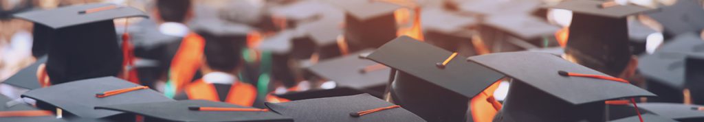 Group of graduates wearing mortar board hats