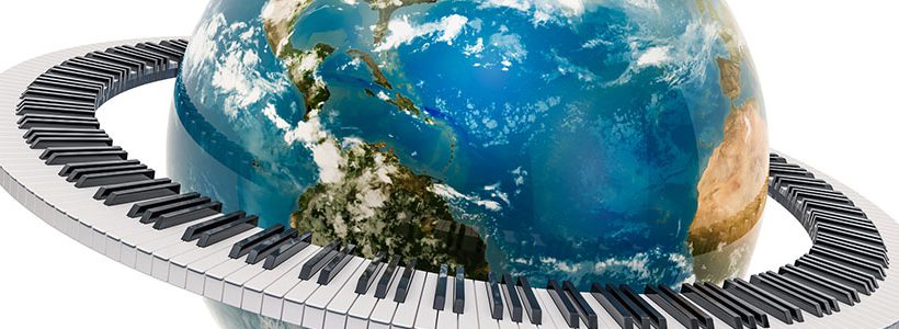 Photo of the earth surrounded by a piano keyboard