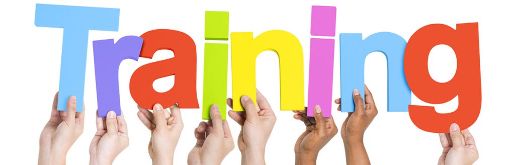 Hands Holding Colorful Letters To Form Training